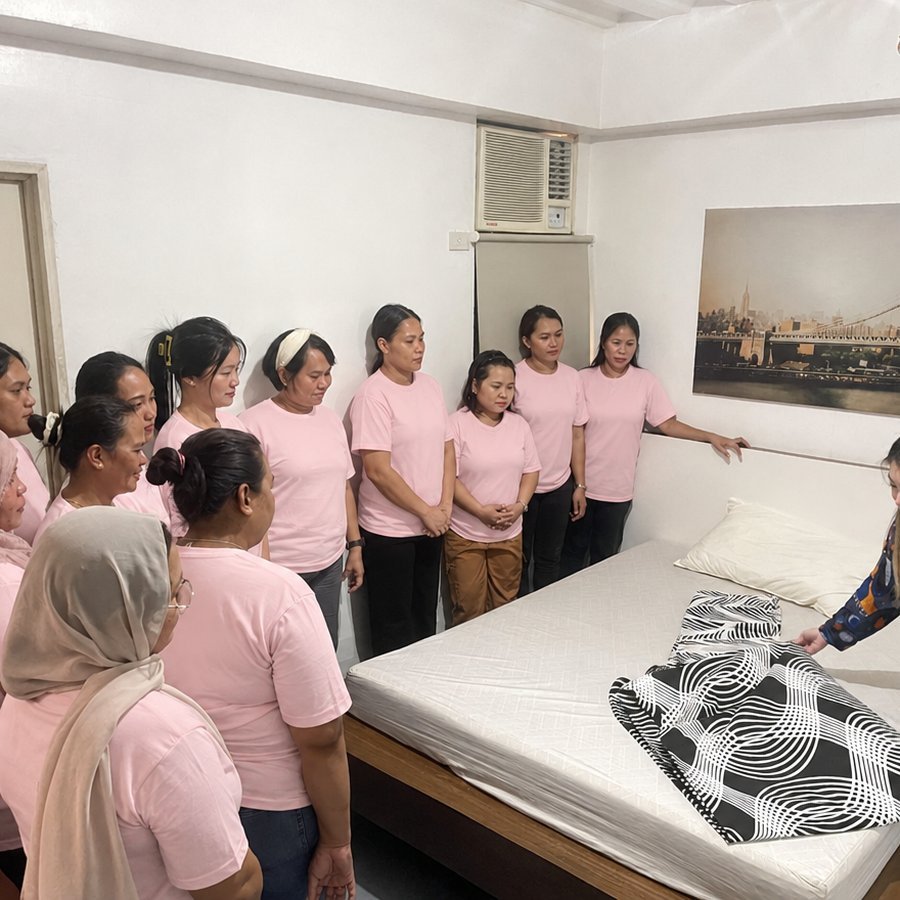 Bed-making practice during helper training